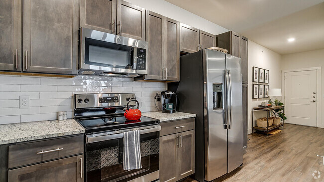 Kitchen with Energy-Efficient Stainless Steel Appliances - Cortland Chisholm Trail Rental