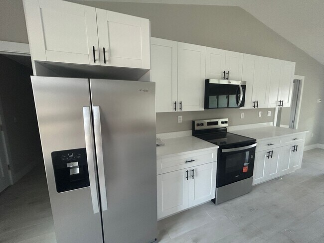 Photo - Coming soon 4/3 new construction overlooking canal