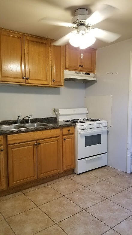 Kitchen includes Stove, Refrigerator - 1301 Grace Ave Apartments Unit 2