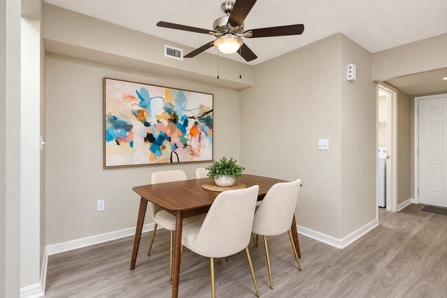 Step into Mosaic, where stylish design meets comfort. The spacious dining area, adorned with modern art, invites you to create memories. Embrace convenience and elegance in every detail. Explore your new home today!