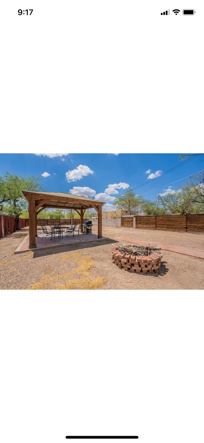 Large backyard with gazebo, patio set and grill. - 1229 N 4th Ave