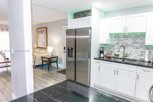 Building Photo - 6190 W 19th Ave Unit 201