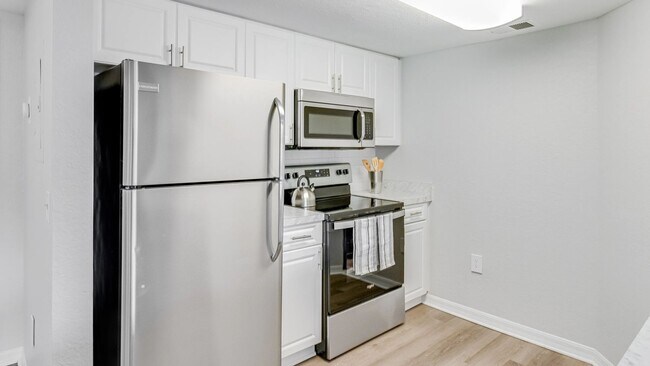 Indulge in our spacious, well-equipped kitchens, your hub for culinary creativity. - Somerset Palms