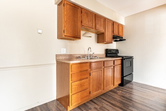 Updated Apartments Featuring Carpeted Bedrooms, Neutral Paint Schemes, Granite Style Countertops, Hardwood Style Floors, Shaker Style Cabinets, Matching Black Appliances, Spacious Closets
