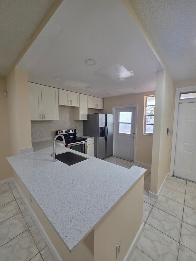 Building Photo - 5335 NW 10th Ct Unit 208