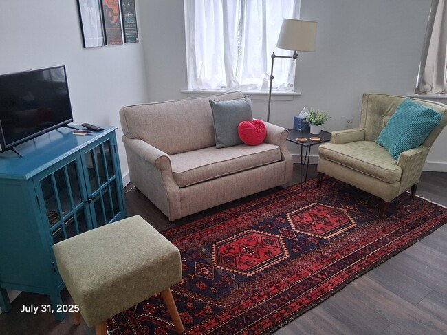 Living area with twin sofa bed - 818 12th St Unit 203