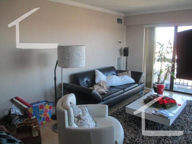 Photo - Spacious Top-Floor 2-Bedroom with Heat Included & Garage Parking!