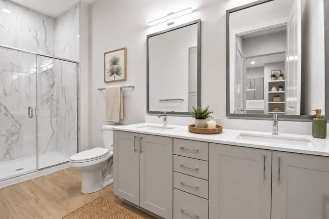 Refined finishes and a modern sensibility transform the bathroom into a space that’s both beautiful and beautifully functional.
