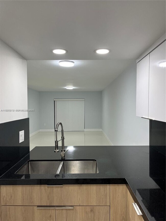 Building Photo - 9917 W Okeechobee Rd Unit 203