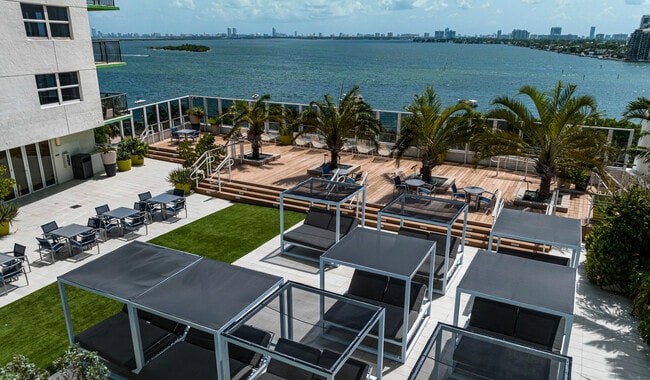Expansive pool deck with cocktail service and stunning views of Biscayne Bay