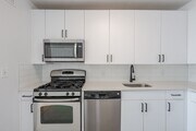 Sleek stainless steel appliances and modern cabinetry