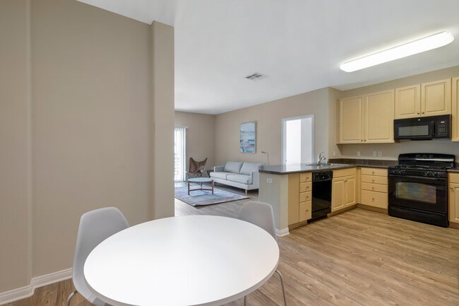 Furnished+ apartment homes include a dining set (Representative Image – exact items and style of furnishings may vary)