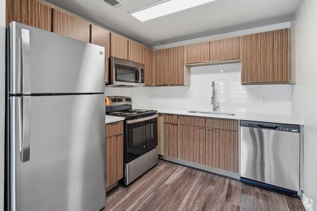 Renovated kitchen with stainless steel appliance package - Azul Rental