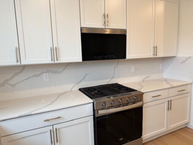 Photo - Elegant 4-Bed, 4-Bath 3-Story Home with Gourmet Kitchen & Private Backyard