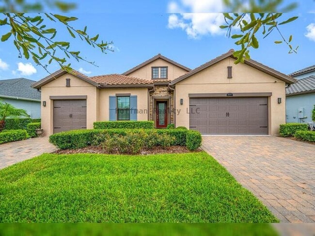 Building Photo - Luxury 4-Bedroom Home with 3-Car Garage in Gated Promenade at LakePark