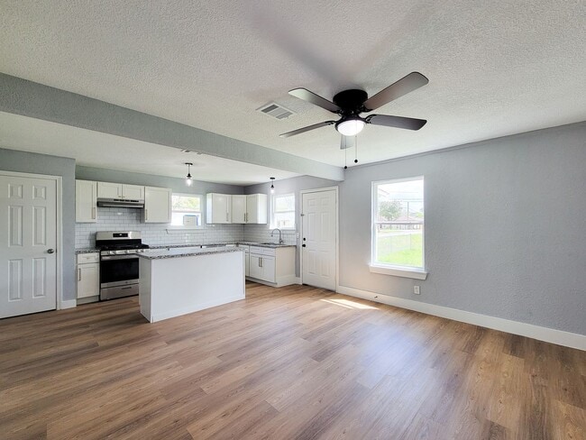 Photo - This beautifully updated 4-bedroom home is just under two miles from Highway 288 and Loop 610, ma...