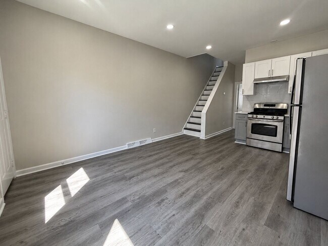 Photo - Spacious 4 Bedroom Home with Private Backyard & Flexible Living Space