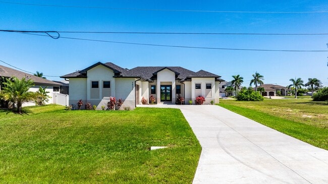 Building Photo - Brand-New Coastal Retreat | 4BR Home in NW Cape Coral