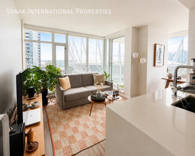 Photo - Bright 1 Bed + Den + Solarium | Pool, Gym & Rooftop Patio
