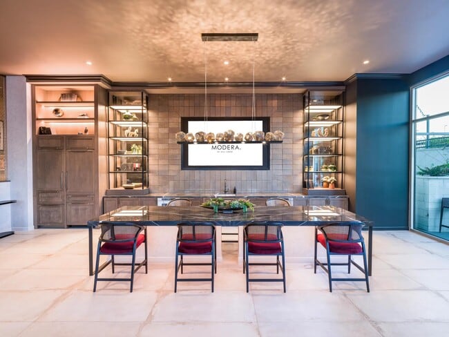 The first-floor lounge offers vibrant gathering spaces with shuffleboard, ping pong, and an outdoor courtyard for lawn games.