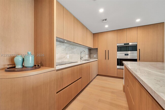 Building Photo - 1176 97th St Unit 502