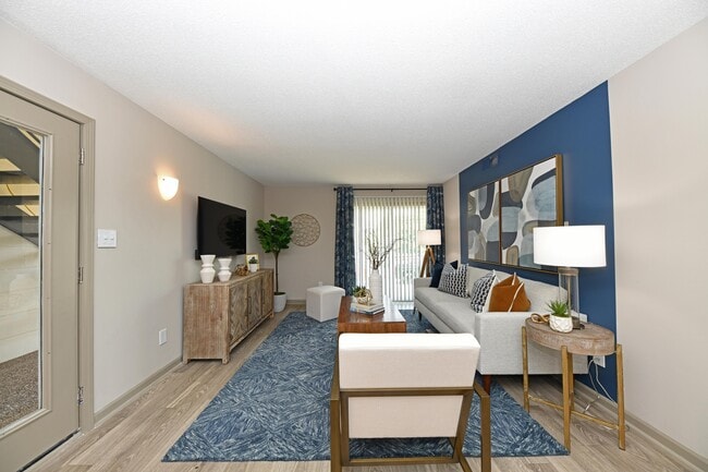 Living Room with Hardwood Style Flooring - Preston Apartment Homes