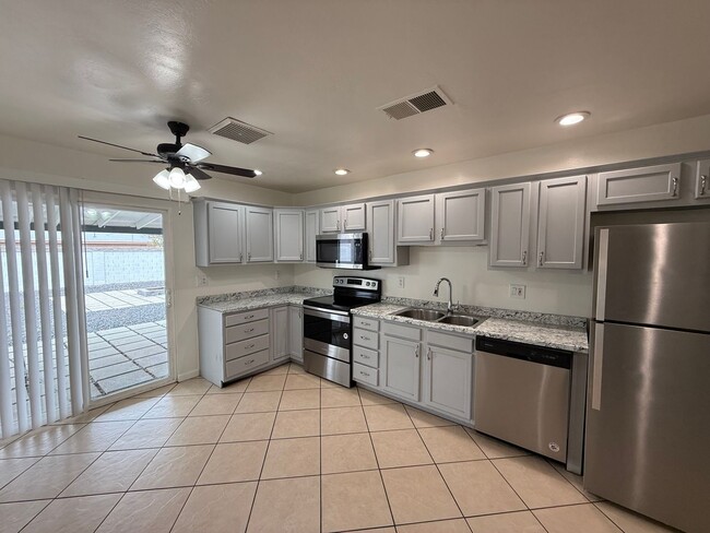 Photo - 4 Bedroom Home with Large Backyard | Modern Landscaping | Utilities Included