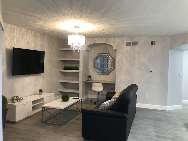 Living Room fully furnished with modern decor! - 7350 Westpointe Blvd Unit 212