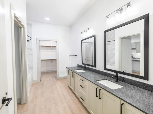 Upgrade your routine with bathrooms featuring double vanities, sleek granite countertops, and designer matte black plumbing fixtures.