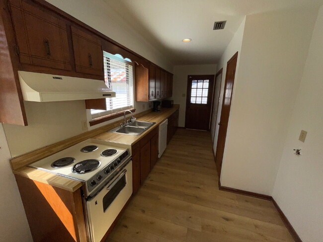 Photo - Welcome home to this charming 2-bedroom, 1-bath residence featuring a warm and inviting layout. E...