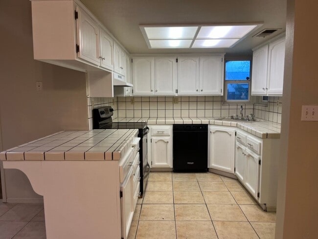 Photo - Located in a great neighborhood, 3-4 bedroom, 2-bath home with a 2-car garage.