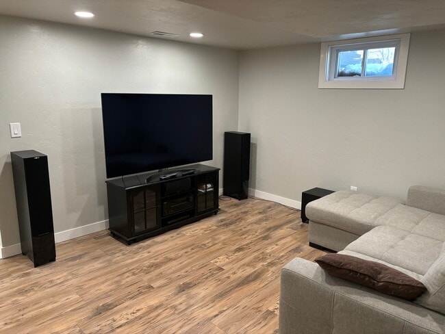 Large TV with Surround Sound - 3044 W Platte Ave Unit Basement Apt