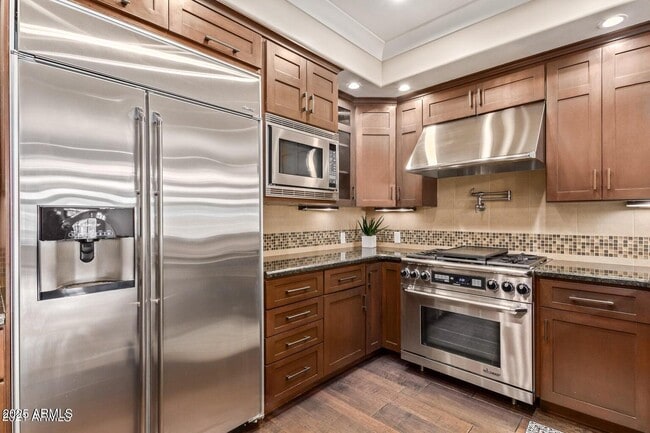 Building Photo - 4909 N Woodmere Fairway Unit 1003