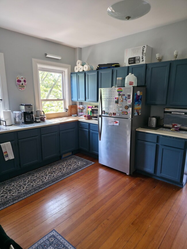 Kitchen fridge and counter with built in butcher block - 86 Holden St Unit 2