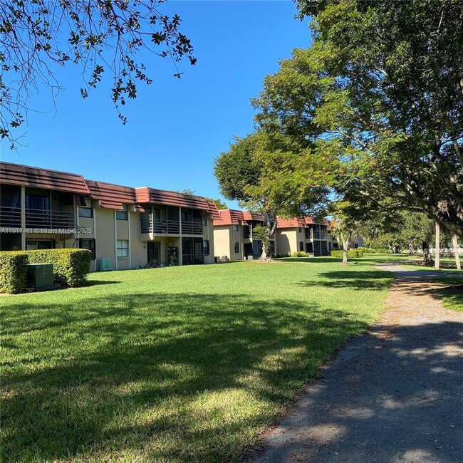 Building Photo - 14847 SW 104th St Unit 10-203