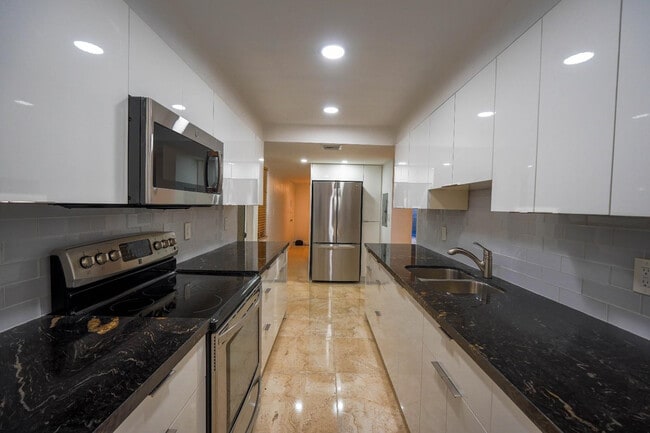 Building Photo - 1075 92nd St Unit 201