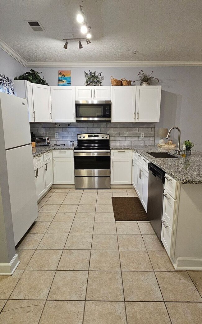 Photo - Stunning First-Floor, Fully Furnished Condo with Pond Views