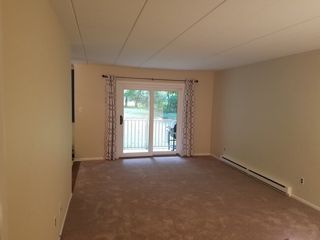 Family room with new carpets and back slider - 300 Campbell Cir Unit F2