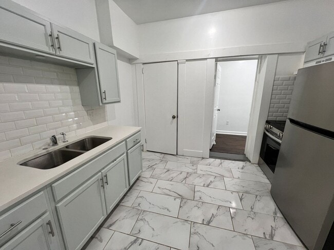 Photo - Stylish 2-Bedroom Unit Featuring Decorative Fireplace