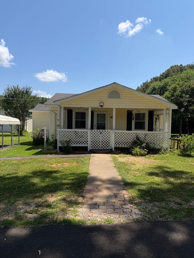 Building Photo - Charming 2-Bedroom Home with an Enclosed Sunroom & Peaceful Outdoor Living