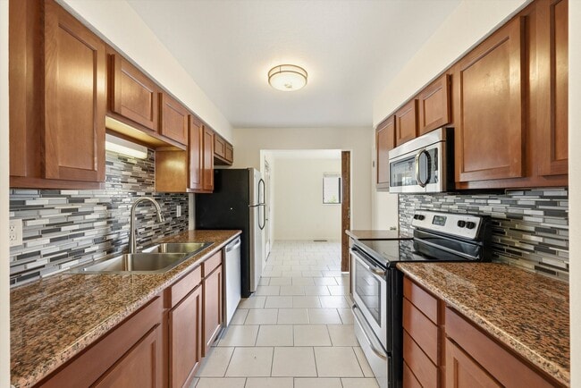 Photo - Spacious 3 Bedroom Home | 2 Bonus Rooms, Huge Yard & Detached 2-Car Garage