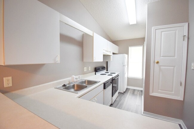 Photo - 2BR Patio Home with Open Layout, LVP Flooring, Private Fenced Yard, HOA Lawn Care & Convenient Bl...
