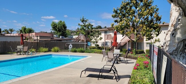 Crystal clear swimming pool and sun deck at Plaza Verde Apartments in Escondido, California. - Plaza Verde