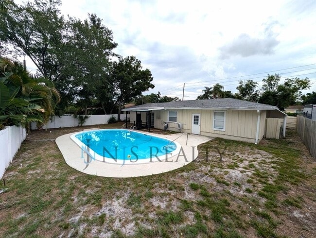 Photo - Beautiful 4/2/2 home with a POOL, 1700 Sq. Ft. with fenced yard, TONS of renovations