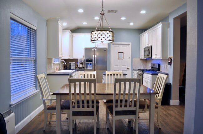 Facing the dining room/ Kitchen with pantry/utility room door in background) - 1405 Amber Day Dr