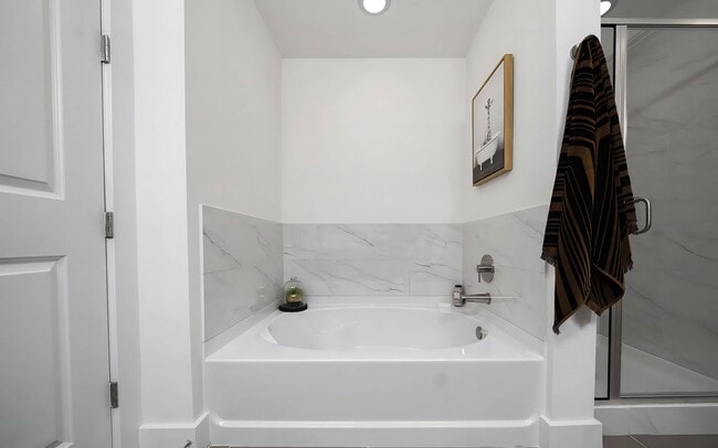 Spa-Inspired Bathroom with Deep Soaking Tub and Modern Fixtures