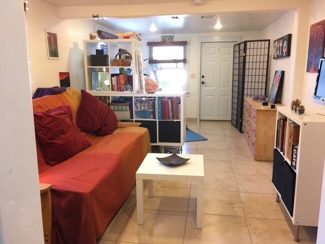 Large living room with yoga/ bike storage area - 2522 E Lee St Unit C