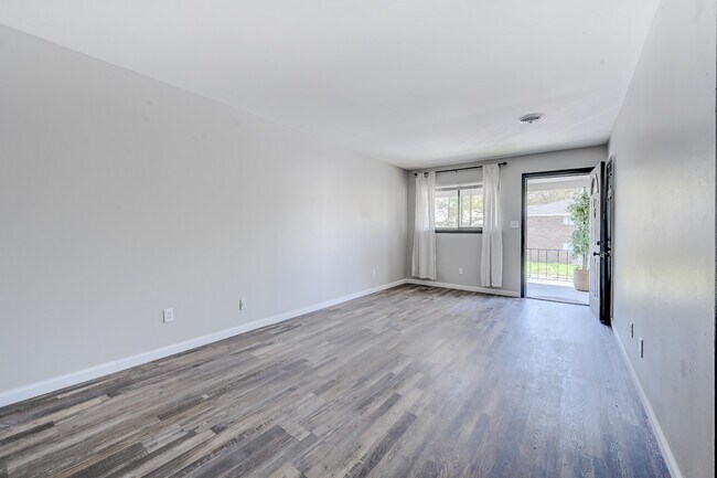 LIVING ROOM (VIEW FROM THE KITCHEN) - Madison Place Boutique Apartments
