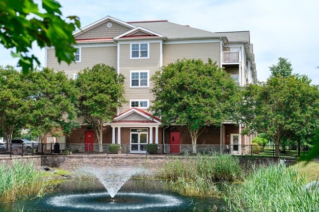 The Promenade Apartments - Building Exterior and Water Feature