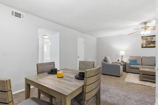 Share meals and make memories in the cozy dining space at Aspen Run Apartments in Tallahassee. - Aspen Run I and II